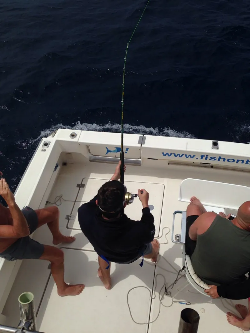 Anglers in the cockpit fighting a fish